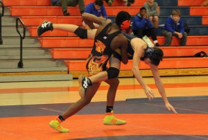 Elijah Cox from Blackman gets a takedown on an Eagle wrestler.