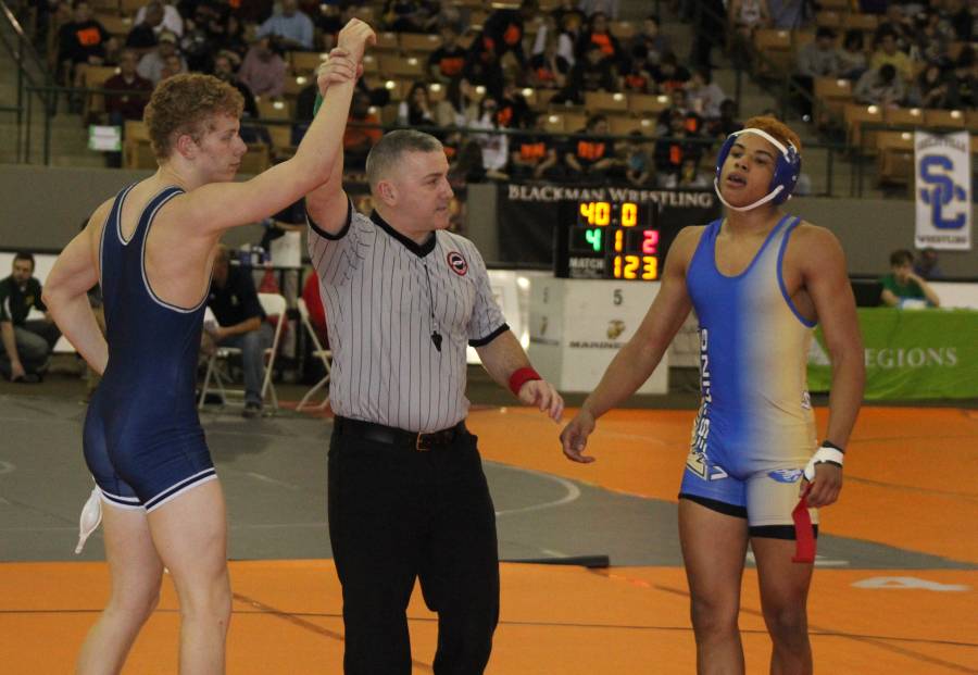 Christian Salter gets his hand raised after a win over Karnes
