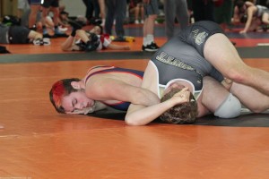Tyler Barber pins his opponent